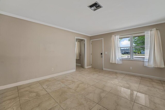 732 Neil Rd Unit 1-4, West Palm Beach, FL 33415 - spare room featuring ornamental molding and baseboards