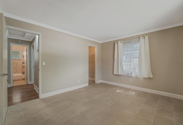 732 Neil Rd Unit 1-4, West Palm Beach, FL 33415 - empty room with ornamental molding, attic access, and light tile patterned floors