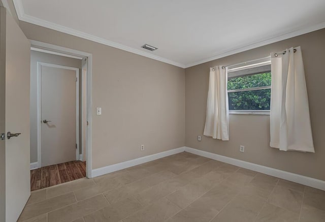 732 Neil Rd Unit 1-4, West Palm Beach, FL 33415 - spare room with crown molding and light tile patterned flooring