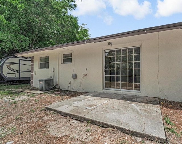 732 Neil Rd Unit 1-4, West Palm Beach, FL 33415 - back of property featuring stucco siding and a patio