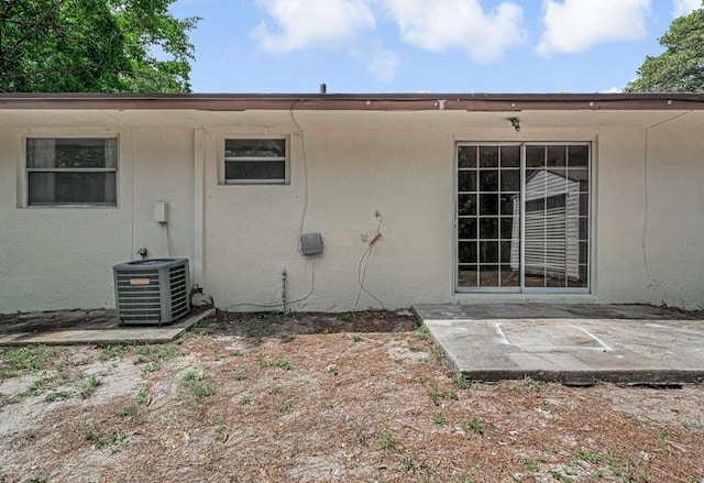 732 Neil Rd Unit 1-4, West Palm Beach, FL 33415 - rear view of property featuring stucco siding and a patio