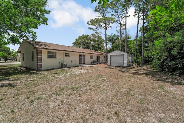 732 Neil Rd Unit 1-4, West Palm Beach, FL 33415 - back of property with a shed and a detached garage