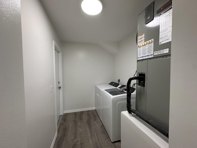 226 SW Statler Ave, Port Saint Lucie, FL 34984 - laundry room featuring washing machine and dryer, dark wood-style flooring, and heating unit