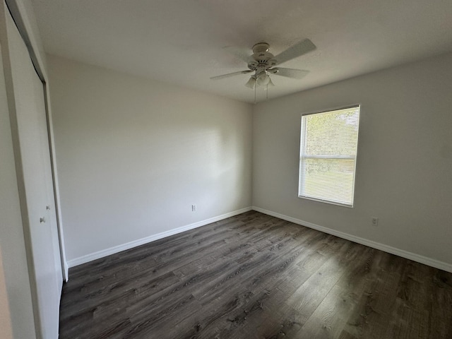 226 SW Statler Ave, Port Saint Lucie, FL 34984 - empty room featuring dark wood-style flooring and a ceiling fan