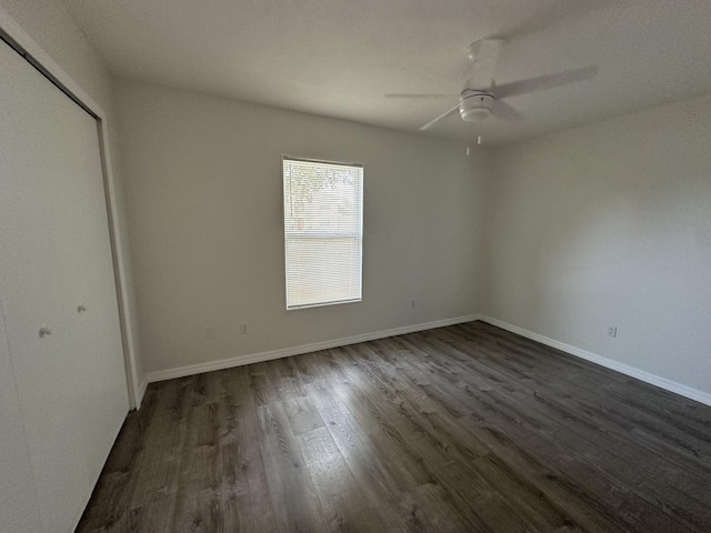 226 SW Statler Ave, Port Saint Lucie, FL 34984 - unfurnished bedroom with dark wood-style floors, a closet, and a ceiling fan