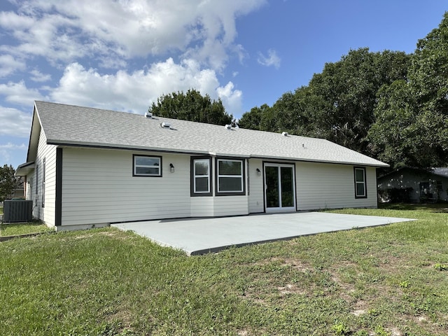 226 SW Statler Ave, Port Saint Lucie, FL 34984 - rear view of property featuring a patio area, a yard, and roof with shingles