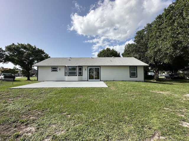 226 SW Statler Ave, Port Saint Lucie, FL 34984 - back of property with a patio area and a lawn