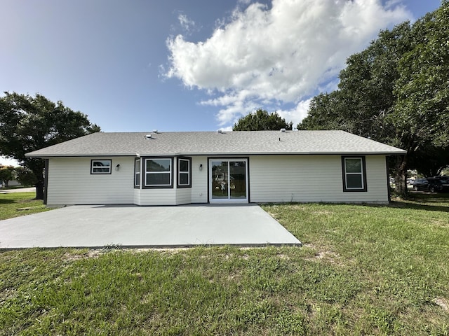 226 SW Statler Ave, Port Saint Lucie, FL 34984 - rear view of property with a patio and a yard