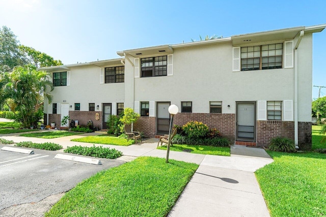 421 N Cypress Dr Unit 15, Tequesta, FL 33469 - view of property featuring uncovered parking