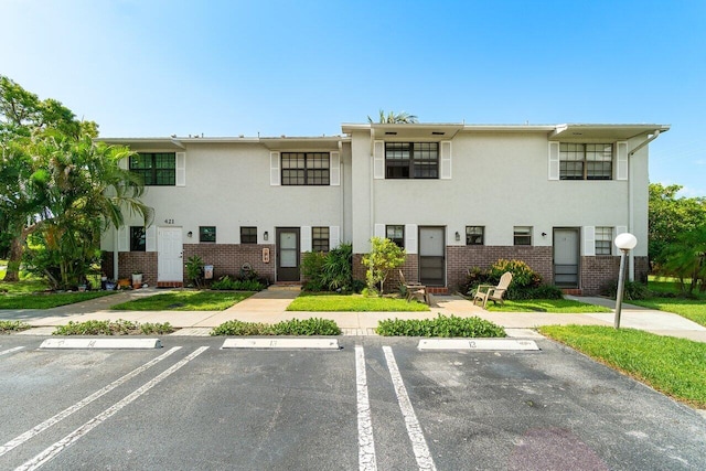 421 N Cypress Dr Unit 15, Tequesta, FL 33469 - view of property with uncovered parking