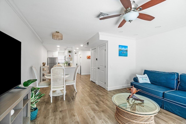 421 N Cypress Dr Unit 15, Tequesta, FL 33469 - living room featuring ornamental molding, ceiling fan, light wood-style flooring, and recessed lighting