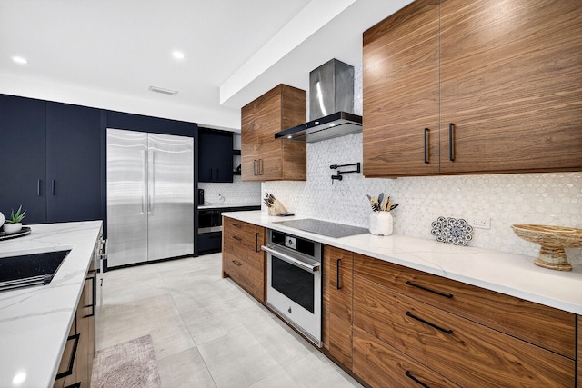 1807 NE 18th St, Fort Lauderdale, FL 33305 - kitchen featuring stainless steel appliances, wall chimney range hood, modern cabinets, brown cabinetry, and backsplash