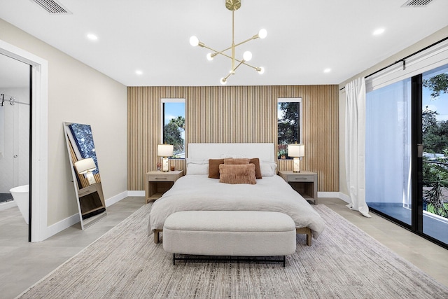 1807 NE 18th St, Fort Lauderdale, FL 33305 - bedroom with a chandelier, multiple windows, recessed lighting, and concrete floors