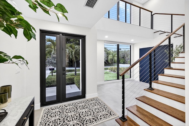1807 NE 18th St, Fort Lauderdale, FL 33305 - entryway featuring stairway, french doors, and a high ceiling