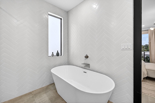 1807 NE 18th St, Fort Lauderdale, FL 33305 - ensuite bathroom with a freestanding bath and tile walls