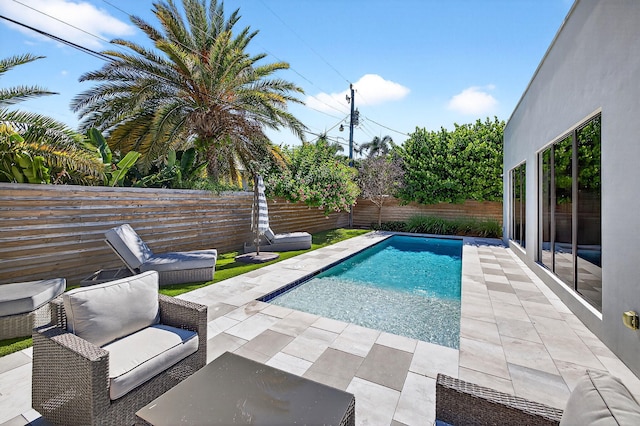 1807 NE 18th St, Fort Lauderdale, FL 33305 - view of swimming pool with a fenced backyard and a patio area
