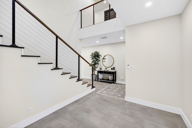 1807 NE 18th St, Fort Lauderdale, FL 33305 - foyer with stairs, recessed lighting, and a towering ceiling