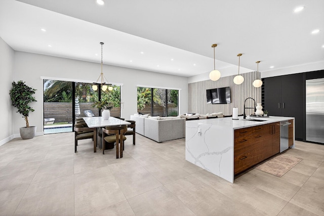 1807 NE 18th St, Fort Lauderdale, FL 33305 - kitchen featuring modern cabinets, appliances with stainless steel finishes, recessed lighting, a spacious island, and pendant lighting