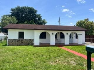 9940 SW 48th St, Miami, FL 33165 - view of front facade with a porch, stucco siding, and stone siding