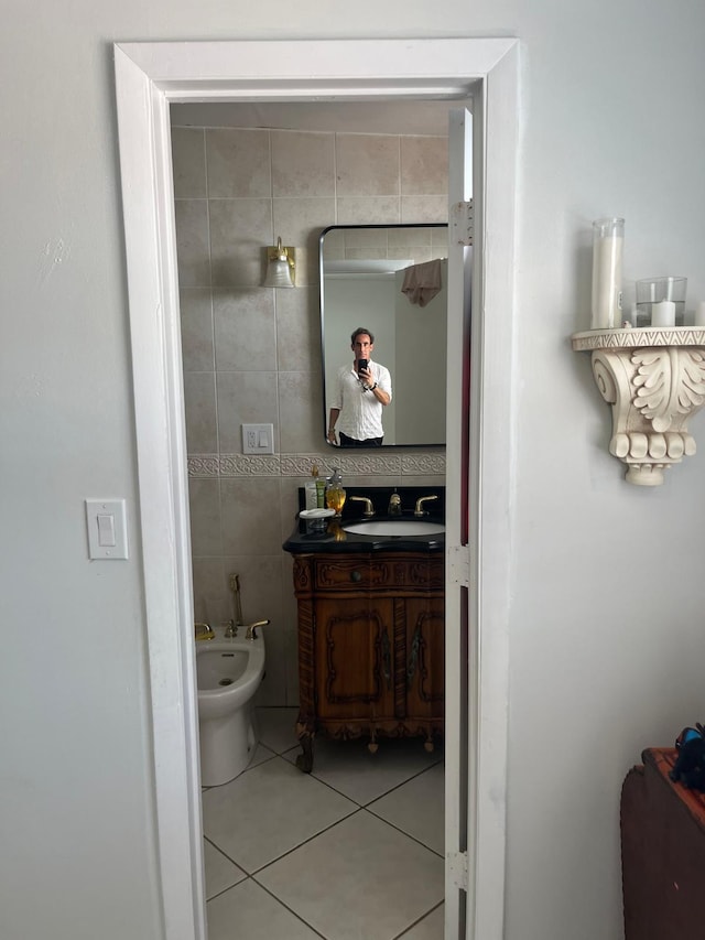 9940 SW 48th St, Miami, FL 33165 - bathroom featuring a bidet, vanity, tile walls, and tile patterned floors