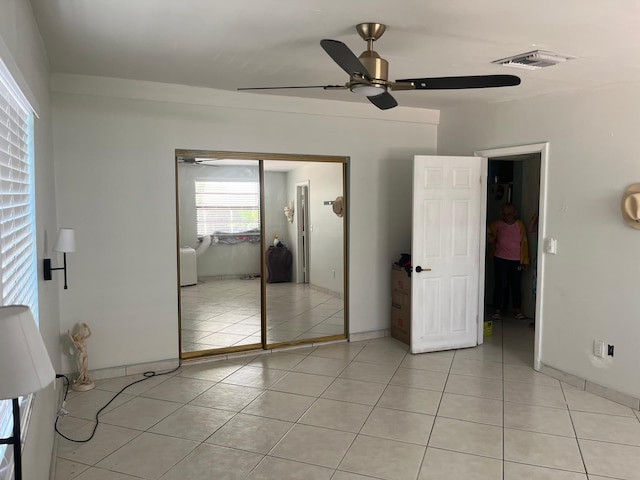 9940 SW 48th St, Miami, FL 33165 - unfurnished bedroom featuring a closet, light tile patterned floors, and ceiling fan