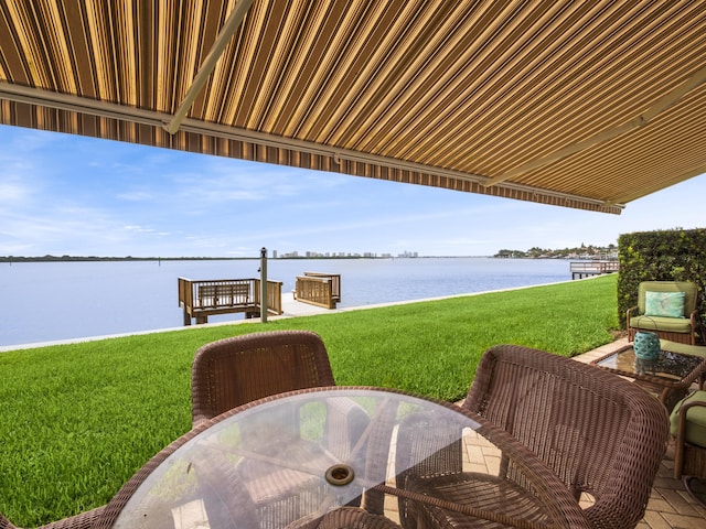 52 Yacht Club Dr Unit 103, North Palm Beach, FL 33408 - view of patio / terrace with a water view and outdoor dining area