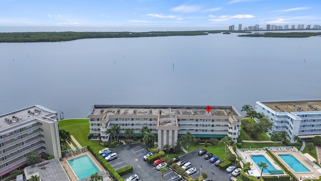 52 Yacht Club Dr Unit 103, North Palm Beach, FL 33408 - bird's eye view of a pool and a nearby body of water