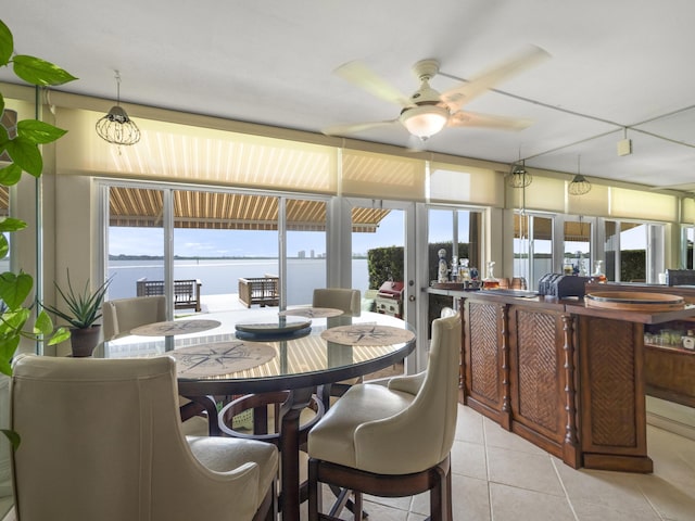 52 Yacht Club Dr Unit 103, North Palm Beach, FL 33408 - tiled dining space with a ceiling fan and plenty of natural light