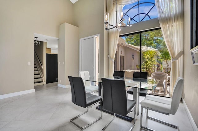 5465 Monterey D Cir Unit D, Delray Beach, FL 33484 - dining space with a towering ceiling, stairs, and a chandelier