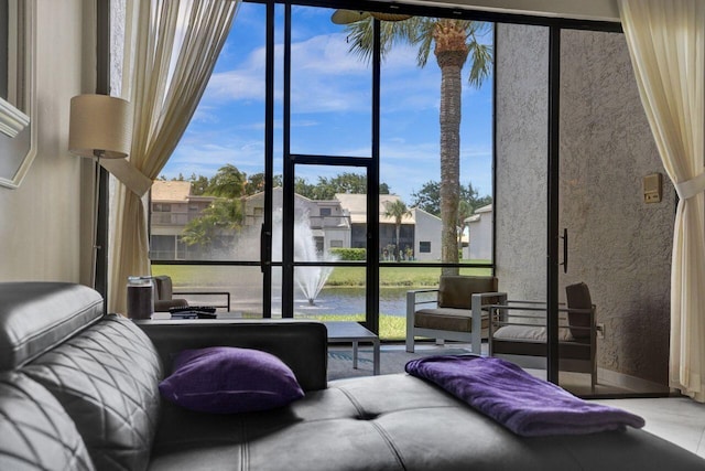 5465 Monterey D Cir Unit D, Delray Beach, FL 33484 - living room featuring a water view, plenty of natural light, and floor to ceiling windows