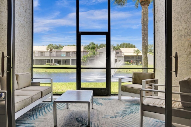 5465 Monterey D Cir Unit D, Delray Beach, FL 33484 - sunroom with healthy amount of natural light, outdoor lounge area, and a water view