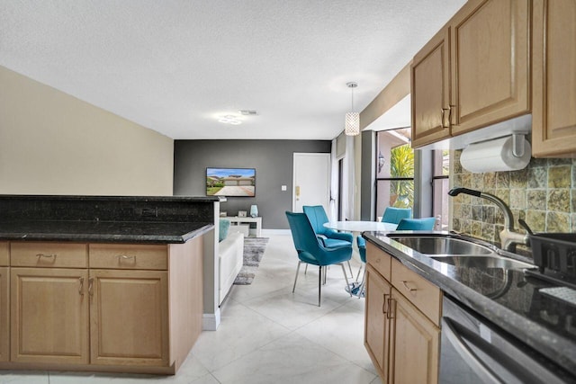 5465 Monterey D Cir Unit D, Delray Beach, FL 33484 - kitchen featuring dishwasher, a textured ceiling, decorative backsplash, and hanging light fixtures
