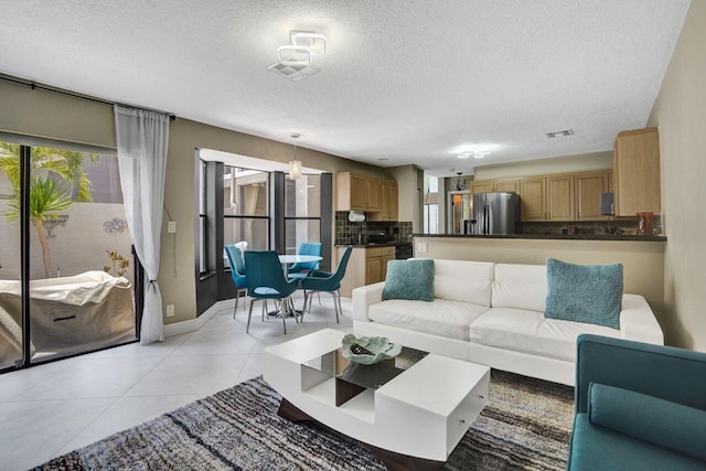 5465 Monterey D Cir Unit D, Delray Beach, FL 33484 - living room with a textured ceiling and light tile patterned flooring