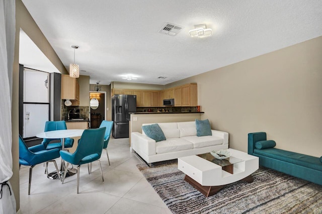 5465 Monterey D Cir Unit D, Delray Beach, FL 33484 - living area featuring a textured ceiling
