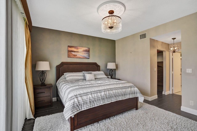 5465 Monterey D Cir Unit D, Delray Beach, FL 33484 - bedroom with a chandelier and wood finished floors