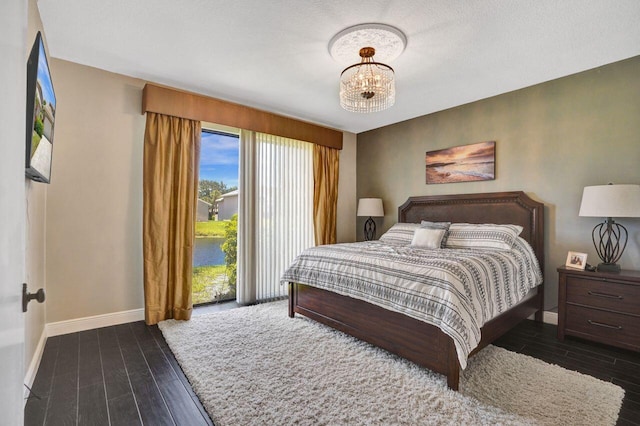 5465 Monterey D Cir Unit D, Delray Beach, FL 33484 - bedroom featuring a chandelier and wood finished floors