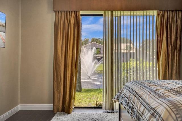 5465 Monterey D Cir Unit D, Delray Beach, FL 33484 - bedroom featuring multiple windows and wood finished floors