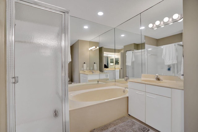 5465 Monterey D Cir Unit D, Delray Beach, FL 33484 - bathroom with a stall shower, a bath, vanity, and recessed lighting