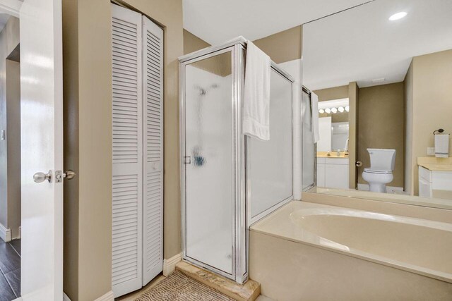 5465 Monterey D Cir Unit D, Delray Beach, FL 33484 - bathroom featuring a closet, a shower stall, a garden tub, vanity, and recessed lighting