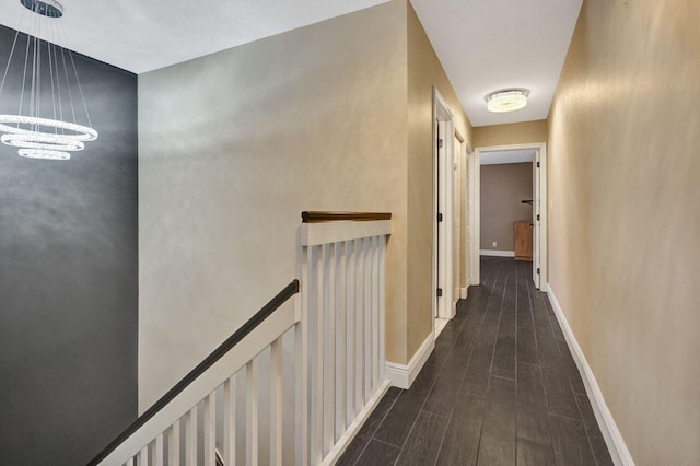 5465 Monterey D Cir Unit D, Delray Beach, FL 33484 - corridor featuring an upstairs landing, a chandelier, and dark wood-style floors