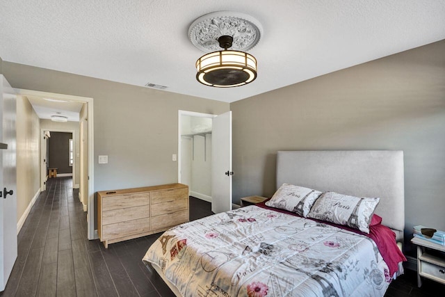 5465 Monterey D Cir Unit D, Delray Beach, FL 33484 - bedroom with dark wood-type flooring and a textured ceiling