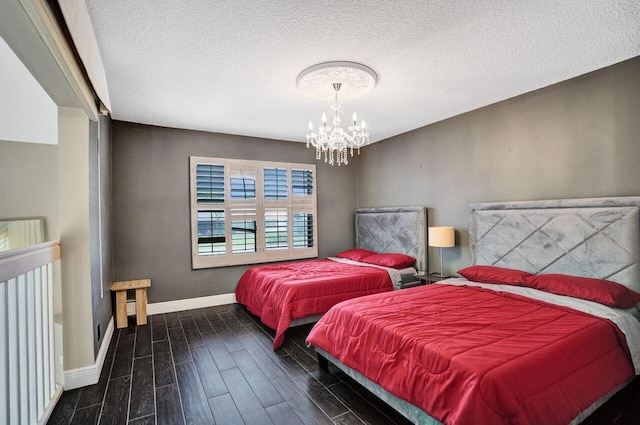 5465 Monterey D Cir Unit D, Delray Beach, FL 33484 - bedroom with a chandelier, wood finished floors, and a textured ceiling