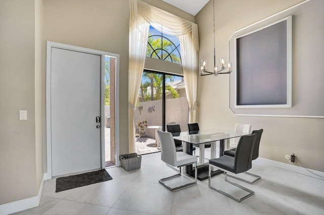 5465 Monterey D Cir Unit D, Delray Beach, FL 33484 - tiled dining space featuring a chandelier and a high ceiling