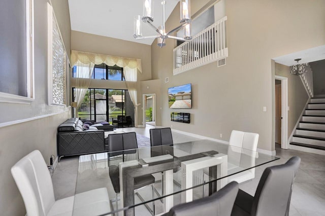 5465 Monterey D Cir Unit D, Delray Beach, FL 33484 - dining area featuring a chandelier, a towering ceiling, and stairway