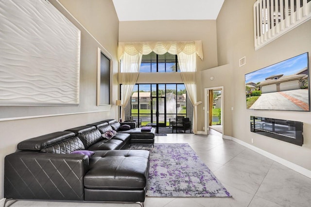 5465 Monterey D Cir Unit D, Delray Beach, FL 33484 - living area with a high ceiling and baseboards