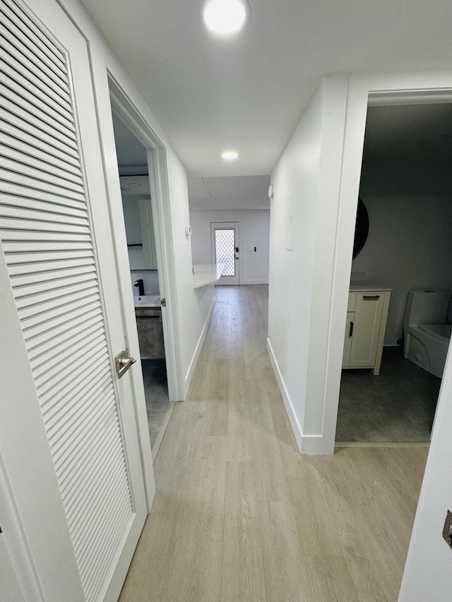 970 Normandy U, Delray Beach, FL 33484 - hall featuring light wood-style floors and baseboards