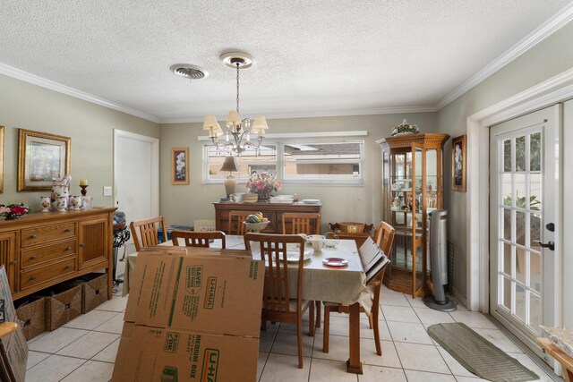2860 Sheriff Way, Winter Park, FL 32792 - dining space featuring french doors, light tile patterned floors, ornamental molding, a chandelier, and a textured ceiling