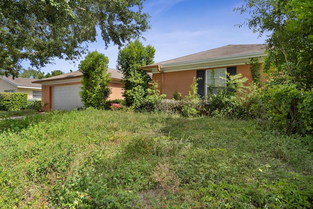 2860 Sheriff Way, Winter Park, FL 32792 - view of yard featuring an attached garage