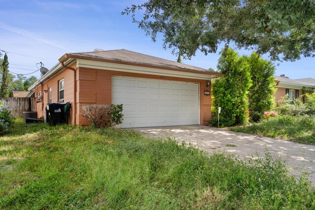 2860 Sheriff Way, Winter Park, FL 32792 - ranch-style house featuring an attached garage and concrete driveway