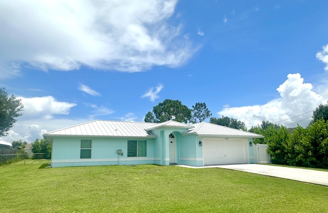 6455 NW Foxglove St, Port Saint Lucie, FL 34986 - ranch-style house featuring a standing seam roof, concrete driveway, a garage, a metal roof, and stucco siding